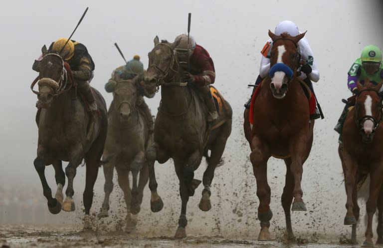 Justify (2R)ridden by jockey Mike Smith crosses the finish line to win the 143rd running of the Preakness Stakes at Pimlico Race Course