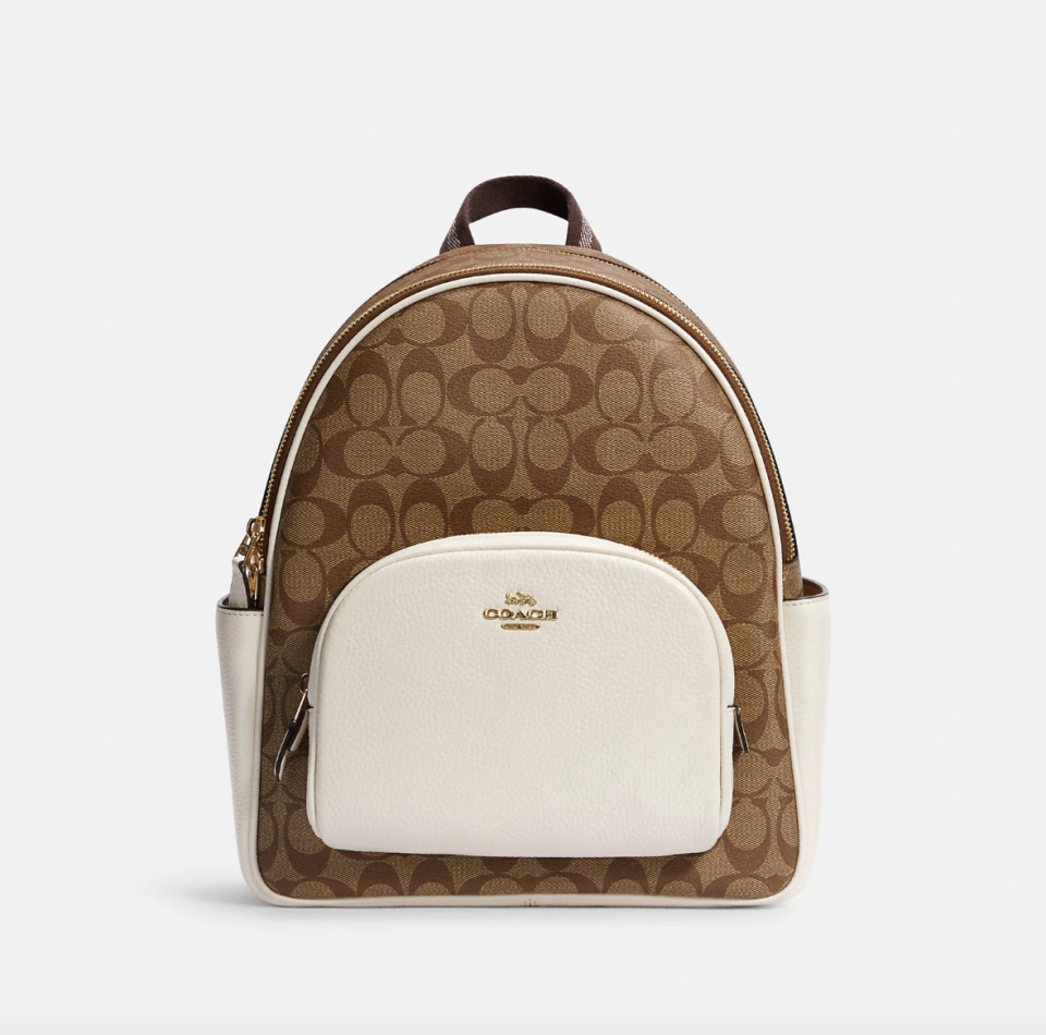 Coach Outlet Court Backpack In Signature Canvas Gold/Khaki/Chalk (Photo via Coach Outlet)