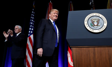 U.S. President Donald Trump walks to the podium after being introduced by Vice President Mike Pence as he arrives at the Missile Defense Review announcement at the Pentagon in Arlington, Virginia, U.S., January 17, 2019. REUTERS/Kevin Lamarque