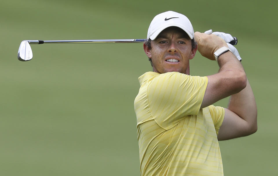 Rory McIlroy hits his fairway shot to the first green during the first round of the Tour Championship golf tournament at East Lake Golf Club on Thursday, Aug. 22, 2019, in Atlanta. (Curtis Compton/Atlanta Journal-Constitution via AP)