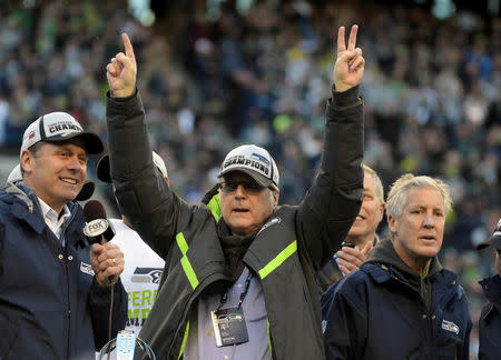 FILE PHOTO: Seattle Seahawks owner Paul Allen celebrates on the podium following their victory over the Green Bay Packers in the NFC Championship Game at CenturyLink Field in Seattle, Washington, U.S., January 18, 2015. Mandatory Credit: Kirby Lee-USA TODAY Sports/File Photo