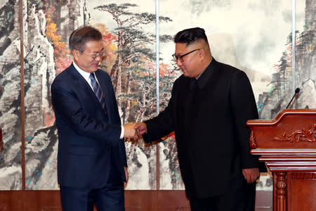 South Korean President Moon Jae-in shakes hands with North Korean leader Kim Jong Un during a joint news conference in Pyongyang, North Korea, September 19, 2018. Pyeongyang Press Corps/Pool via REUTERS