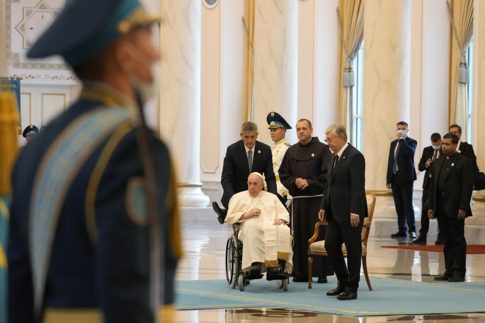 Pope Francis leaves with Kazakhstan's President Kassym-Jomart Tokayev at the end of the welcome ceremony at the Presidential Palace Ak Orda, in Nur-Sultan, Kazakhstan, Tuesday, Sept. 13, 2022. Pope Francis begins a 3-days visit to the majority-Muslim former Soviet republic to minister to its tiny Catholic community and participate in a Kazakh-sponsored conference of world religious leaders. (AP Photo/Andrew Medichini)