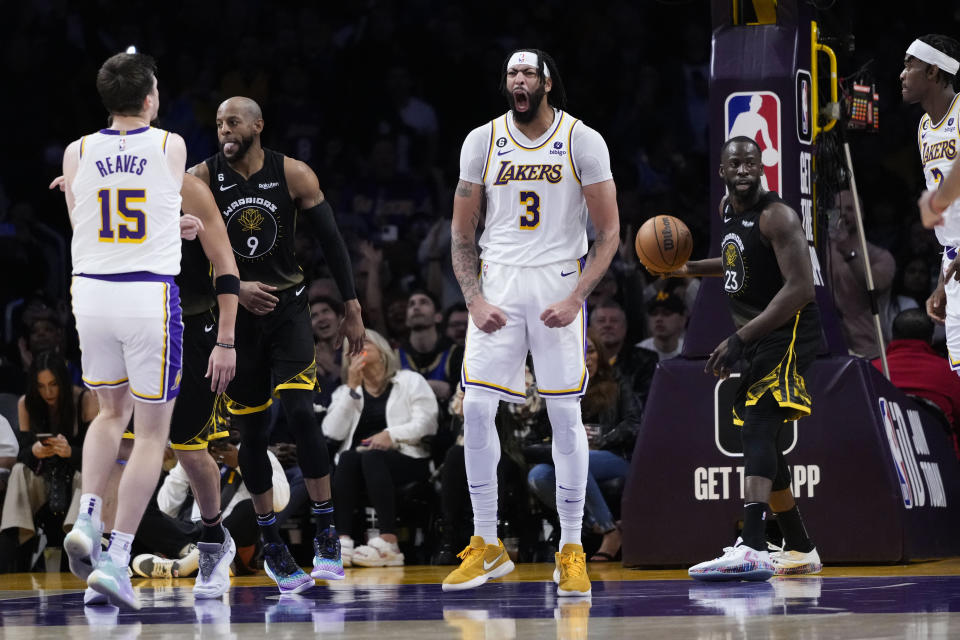 Los Angeles Lakers' Anthony Davis (3) reacts after making a basket during the second half of an NBA basketball game against the Golden State Warriors Sunday, March 5, 2023, in Los Angeles. (AP Photo/Jae C. Hong)