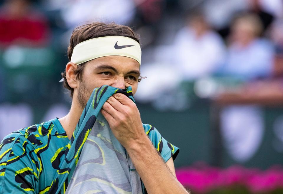 Taylor Fritz of the United States reacts to a point lost to Jannik Sinner of Italy during their quarterfinal match at the BNP Paribas Open at the Indian Wells Tennis Garden in Indian Wells, Calif., Thursday, March 16, 2023. 