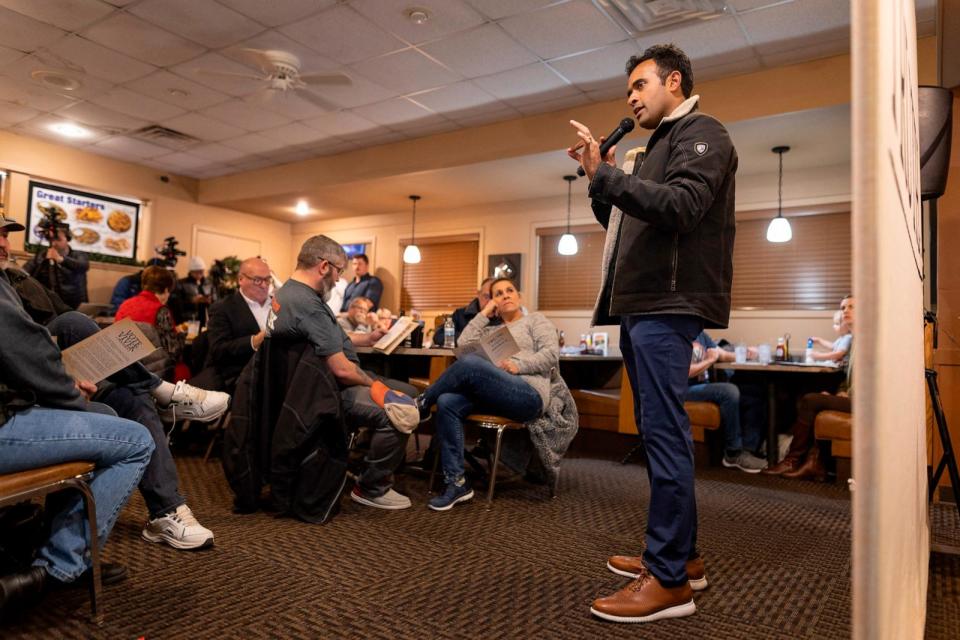 PHOTO: Entrepreneur and 2024 Presidential hopeful Vivek Ramaswamy speaks at a local restaurant during a visit in Cherokee, Iowa, on Dec. 9, 2023, ahead of the Iowa caucus.  (Christian Monterrosa/AFP via Getty Images)