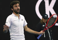 France's Gilles Simon gestures during his second round singles match against Australia's Nick Kyrgios at the Australian Open tennis championship in Melbourne, Australia, Thursday, Jan. 23, 2020. (AP Photo/Lee Jin-man)