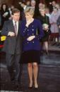 <p>Pairing navy and black is an undeniably timeless combination. Diana wore this navy blazer with gold buttons over a sleek black dress during an outing in Oxford in November 1990.<br></p>