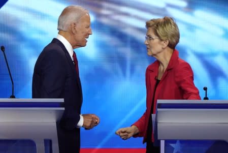 Former Vice President Biden speaks with Senator Warren during the 2020 Democratic U.S. presidential debate in Houston, Texas, U.S.