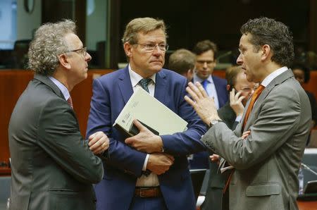 Luxembourg's Finance Minister Pierre Gramegna (L) talks with Belgian Finance Minister Johan Van Overtveldt (C) and Dutch Finance Minister and Eurogroup President Jeroen Dijsselbloem during a European Union finance ministers meeting in Brussels, Belgium, February 12, 2016. REUTERS/Yves Herman