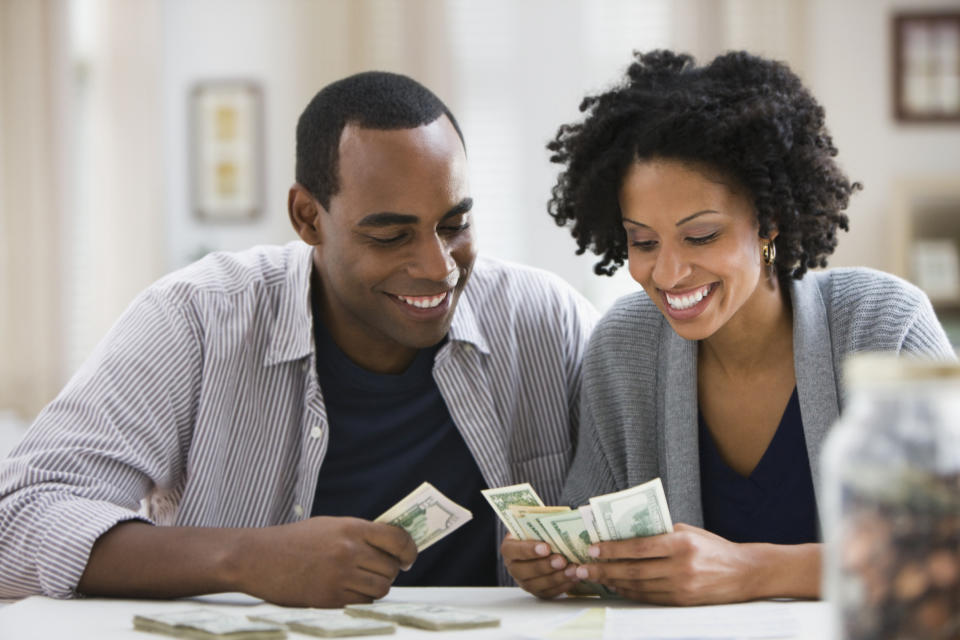 A couple counting money.