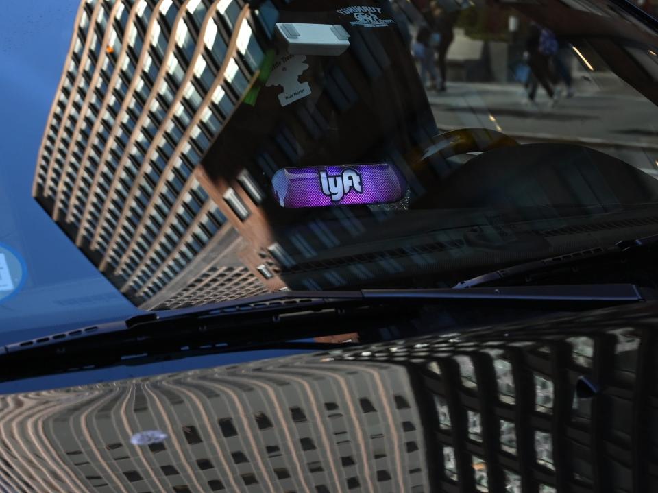 A Lyft ride-sharing car is seen on 42nd Street in New York on March 26, 2019. - Lyft Inc.'s initial public offering is expected to have its (IPO) this week making it the first of the ride-hailing companies to open up to the public. (Photo by TIMOTHY A. CLARY / AFP)        (Photo credit should read TIMOTHY A. CLARY/AFP/Getty Images)