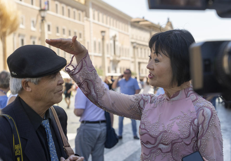 UNESCO Ambassador Kim Phuc, right, recalls how Pulitzer Prize-winning photographer Nick Ut, looked to her 'so short' when they met again 15 years after the end of the Vietnam war, during an interview with The Associated Press after they participated in a general audience with Pope Francis in St. Peter's Square at The Vatican, Wednesday, May 11, 2022. Ut and Phuc are in Italy to promote the photo exhibition "From Hell to Hollywood" resuming Ut's 51 years of work at the Associated Press, including the 1973 Pulizer winning photo of Kim Phuc fleeing her village that was accidentally hit by napalm bombs dropped by the South Vietnamese air force. (AP Photo/Domenico Stinellis)