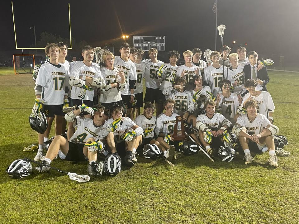 The Catholic boys lacrosse team celebrates its District 1-1A title after defeating West Florida 23-4 on Thursday, April 13, 2023 from Gorecki-LeBeau Stadium