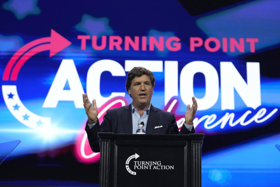 FILE - Tucker Carlson speaks at the Turning Point Action conference, Saturday, July 15, 2023, in West Palm Beach, Fla. Former President Donald Trump's decision to back out of Fox News' first GOP primary debate this week likely costs the network a chance at a very large audience for the end of summer. It also tests the network's ability to pivot yet again after what has been a tough year, paying $787 million to settle a defamation lawsuit just as a trial was to begin, and firing popular personality Tucker Carlson shortly after the settlement. (AP Photo/Lynne Sladky, File)