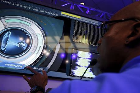 A Genworth brand ambassador points to a hearing display during a Genworth R70i Aging Experience demonstration at the Liberty Science Center in Jersey City, New Jersey, April 5, 2016. REUTERS/Shannon Stapleton