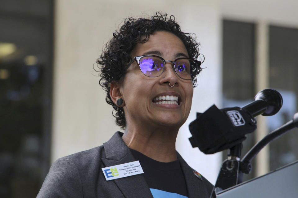 Rebby Kern, education policy coordinator at the LGBTQ+ advocacy group Equality North Carolina, speaks at a news conference Wednesday, Aug. 16, 2023, outside the Legislative Building in Raleigh, N.C. The state legislature's Republican supermajority will attempt later Wednesday to override the Democratic governor's veto of a gender-affirming care ban for minors. (AP Photo/Hannah Schoenbaum)