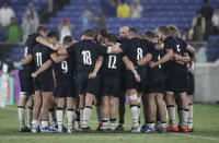 Scotland players embrace following their 27-3 loss to Ireland in their Rugby World Cup Pool A game at International Stadium in Yokohama, Japan, Sunday, Sept. 22, 2019. (AP Photo/Jae Hong)
