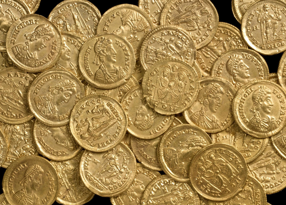 As it turns out, the gold coloring was actually gold, the coin was an ancient Roman solidus, and there were 158 more buried with it, a hoard with an estimated worth of 100,000 pounds sterling, or $156,000, according to The Daily Mail. (AP)  <a href="http://www.huffingtonpost.com/2013/06/07/wesley-carrington-finds-roman-gold-coins_n_3404112.html?utm_hp_ref=unearthed" target="_blank">Read more here</a>