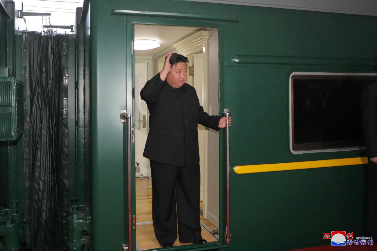 North Korean leader Kim Jong Un waves from a private train as he departs Pyongyang, North Korea, to visit Russia, 10 September 2023 (Reuters)