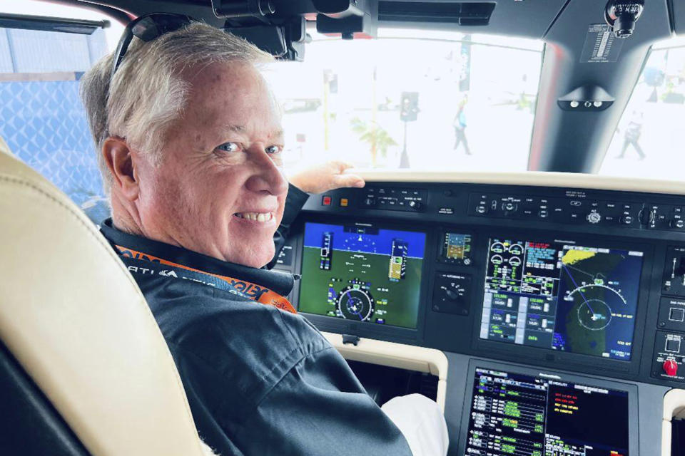 In this undated photo provided by family, pilot Jeff Hefner smiles from the cockpit of a small aircraft. Hefter, pilot of the business jet that flew over Washington and crashed in Virginia Sunday, June 4, 2023, appeared to be slumped over and unresponsive, the fighter jet pilots reported, according to three U.S. officials briefed on the matter. (AP Photo)