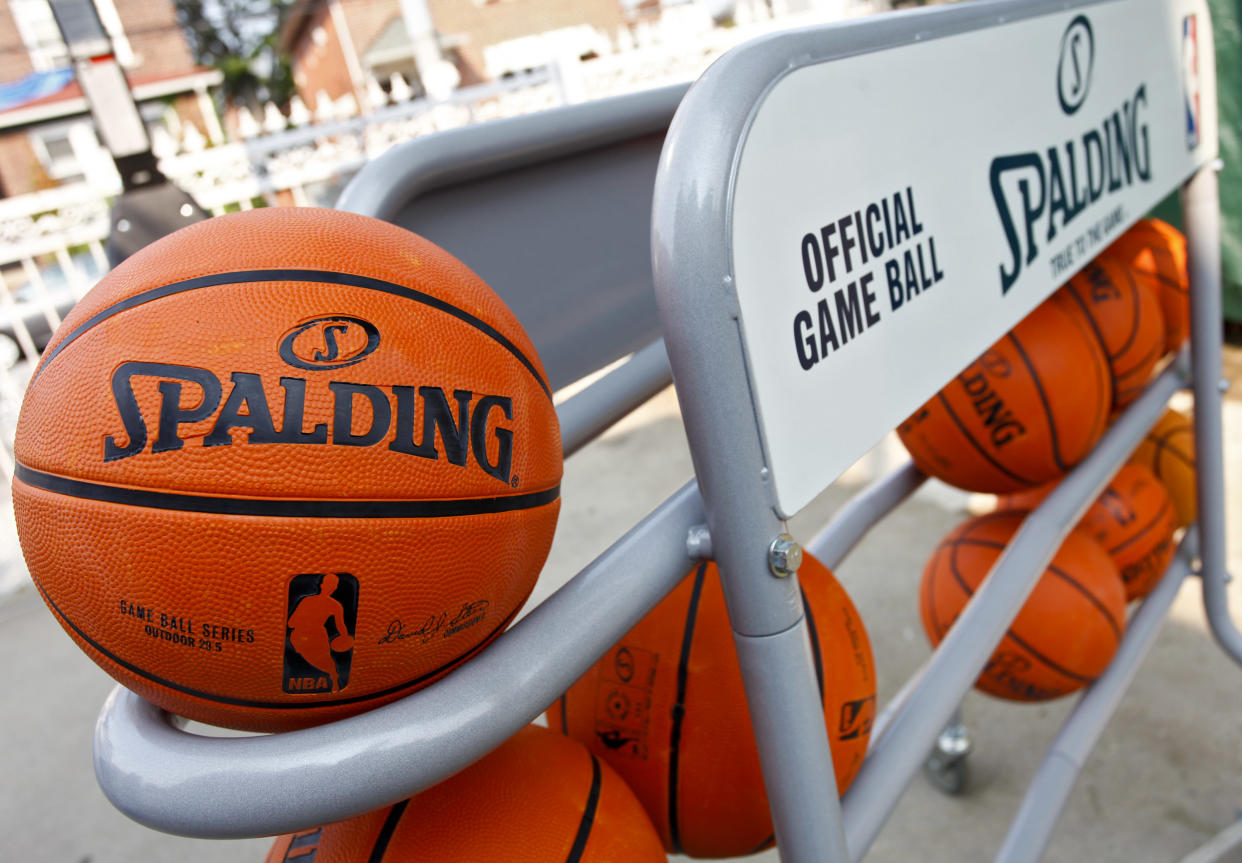 A rack of Spalding basketballs. (Brian Ach/Invision for Spaulding/AP Images)