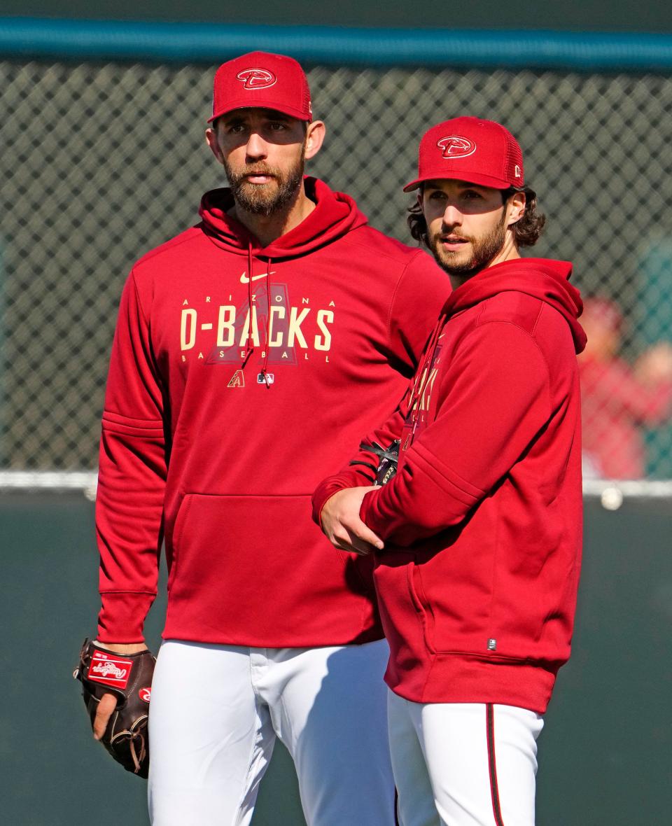 Arizona Diamondbacks pitchers Madison Bumgarner and Zac Gallen during the first day of spring training workouts at Salt River Fields in Scottsdale on Feb. 15, 2023.