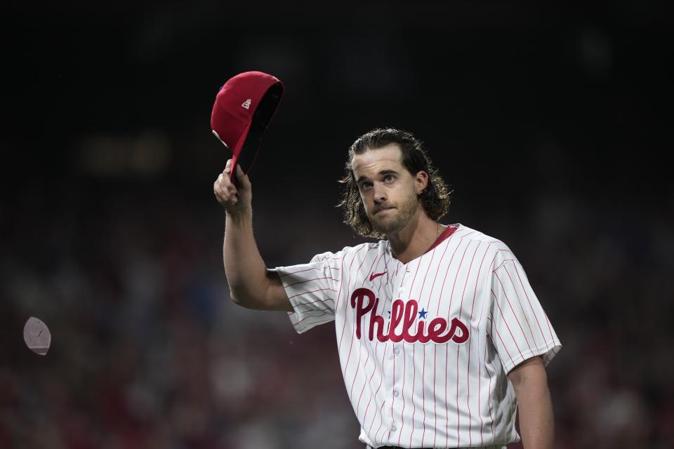 Philadelphia Phillies starting pitcher Aaron Nola tips his hat after being relieved during the sixth inning of Game 3 of a baseball NL Division Series against the Atlanta Braves Wednesday, Oct. 11, 2023, in Philadelphia. (AP Photo/Matt Slocum)