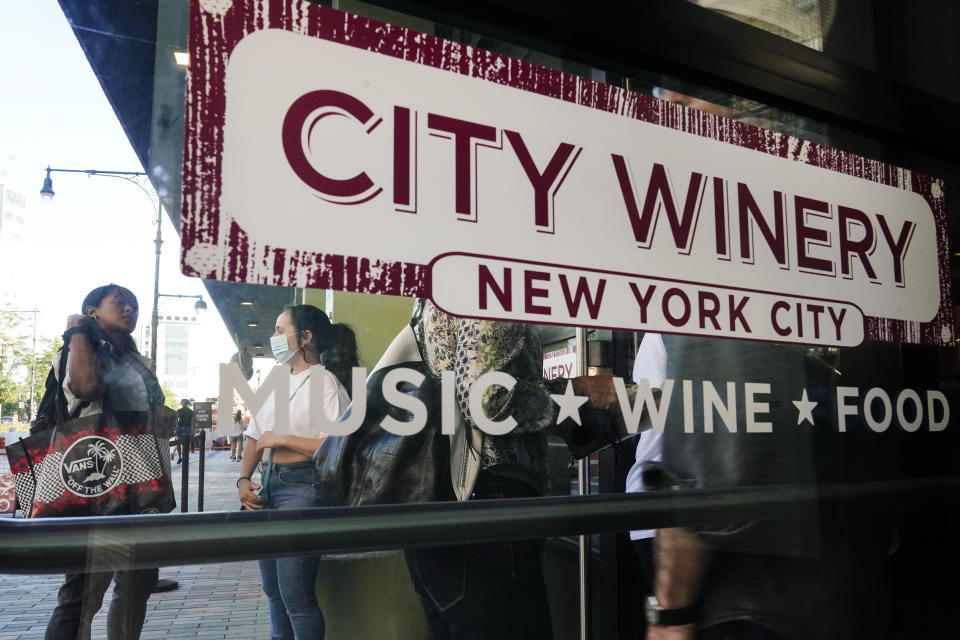 Patrons wait as security personnel check for proof of vaccination as they enter City Winery on Thursday, June 24, 2021, in New York. Customers wanting to wine, dine and unwind to live music at the City Winery's flagship restaurant in New York must show proof of a COVID-19 vaccination to get in. But that's not required at most other dining establishments in the city. And it's not necessary at other City Winery sites around the U.S. (AP Photo/Frank Franklin II)