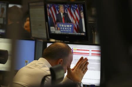 A trader at the stock exchange reacts in Frankfurt, Germany, November 9, 2016. REUTERS/Kai Pfaffenbach/Files