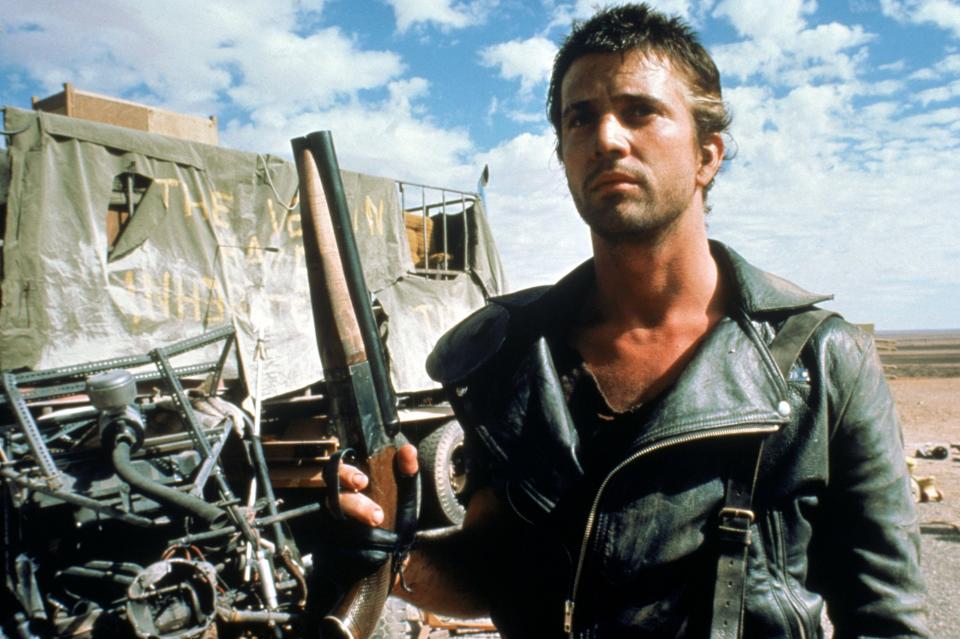 Mel Gibson wearing a black leather jacket in the 1981 film Mad Max 2
