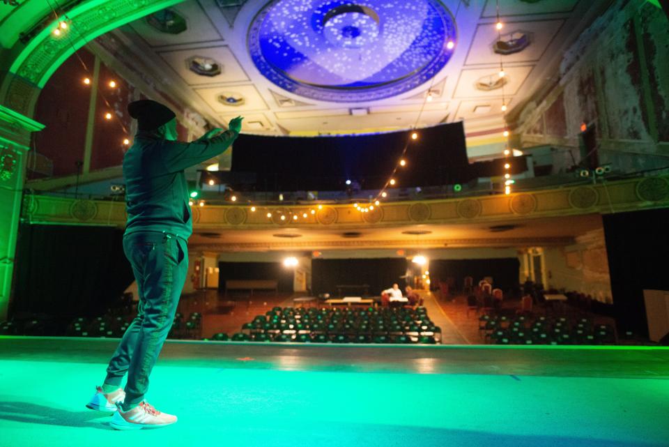 Singer Eddie Wakes looks out over the Jayhawk Theatre on Tuesday as he reminisces about watching movies from the balcony when he was a child growing up in Topeka. Wakes will be performing here Saturday for his "Boundless" tour.