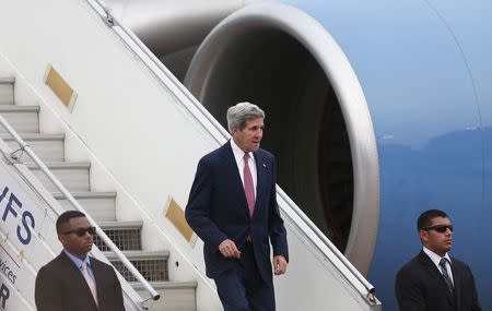 U.S. Secretary of State John Kerry disembarks from an aircraft upon his arrival at the airport in New Delhi July 30, 2014. The visit by Kerry to India is his first following the resounding election win of Prime Minister Narendra Modi in May. REUTERS/Adnan Abidi