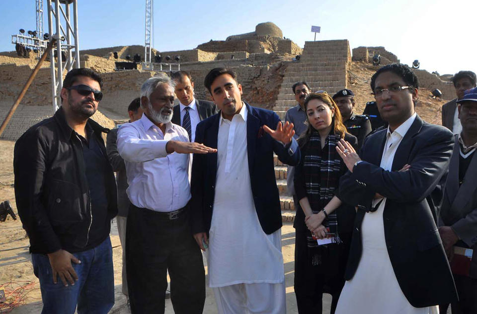 In this Thursday, Jan. 30, 2014 photo provided by Bilawal House, Bilawal Bhutto Zardari, third from left, son of Pakistan's assassinated Prime Minister Benazir Bhutto visits the site of Sindh Cultural Festival in ruins of Mohenjodaro in Pakistan. A plan by Bilawal to hold a cultural festival at an ancient site in southern Pakistan has sparked controversy, with several leading archaeologists saying Friday it could damage the ruins. (AP Photo/Bilawal House)