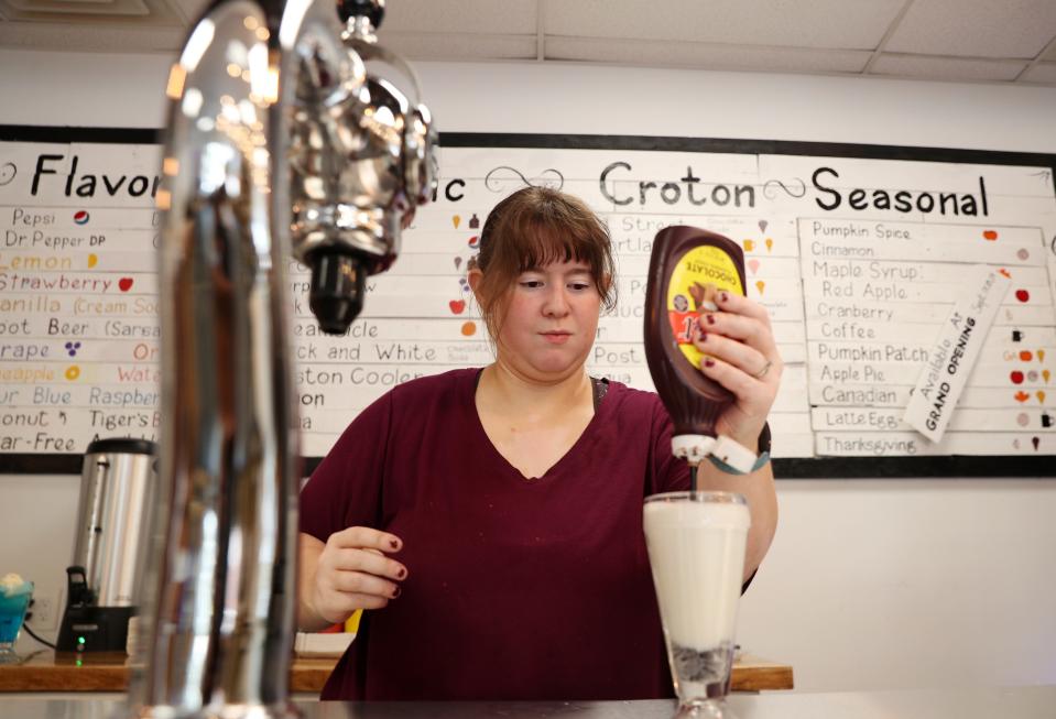 Tessa Tokke makes an egg cream behind the counter at Croton Corners, a combination general store, old school soda shop arcade and tea shop. The store, at the intersection of Grand Street and Old Post Road in Croton, will close at the end of June.