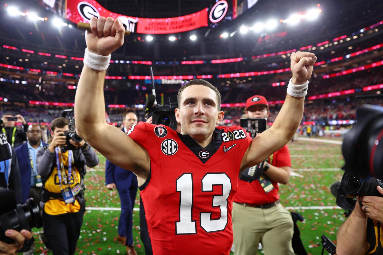 Georgia quarterback Stetson Bennett walks off the field after winning the CFP national championship game over TCU.