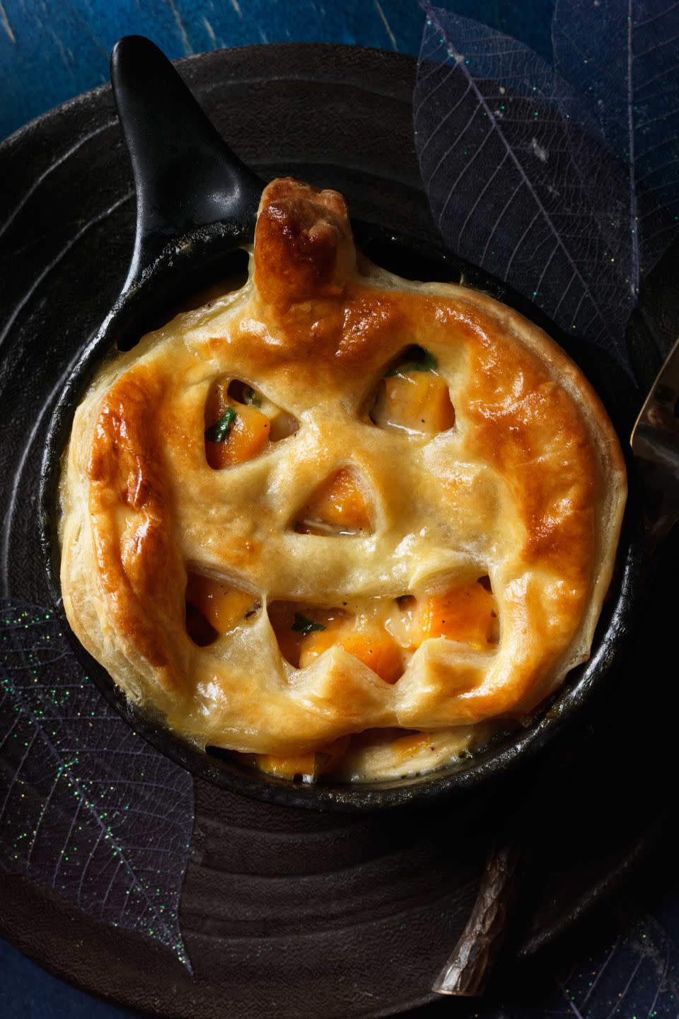 <p>A frightfully tasty main course for Halloween, this <a rel="nofollow noopener" href="https://www.womansday.com/food-recipes/food-drinks/g1969/sweet-potato-recipes/" target="_blank" data-ylk="slk:sweet potato dish;elm:context_link;itc:0;sec:content-canvas" class="link ">sweet potato dish</a> is also a comforting choice <a rel="nofollow noopener" href="https://www.womansday.com/food-recipes/food-drinks/g3165/best-comfort-food-recipes/" target="_blank" data-ylk="slk:throughout winter;elm:context_link;itc:0;sec:content-canvas" class="link ">throughout winter</a>. Serve it in ramekins as shown, or as one big pie with uncut puff pastry on top, baking until it turns golden.</p><p><a rel="nofollow noopener" href="https://www.womansday.com/food-recipes/food-drinks/recipes/a11925/jack-o-lantern-chicken-sweet-potato-potpies-recipe-123644/" target="_blank" data-ylk="slk:Get the recipe.;elm:context_link;itc:0;sec:content-canvas" class="link "><strong>Get the recipe.</strong></a></p>