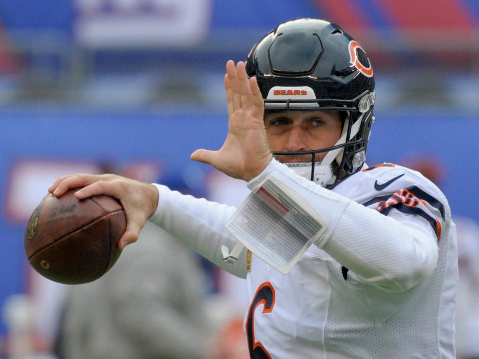 Jay Cutler warms up before a game against the New York Giants.