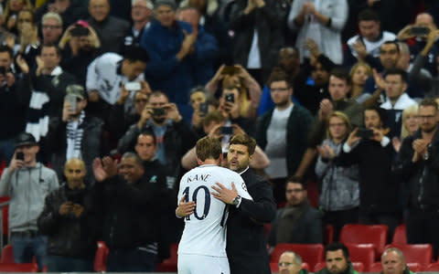 Tottenham Hotspur's English striker Harry Kane is embraced by Tottenham Hotspur's Argentinian head coach Mauricio Pochettino - Credit: getty images