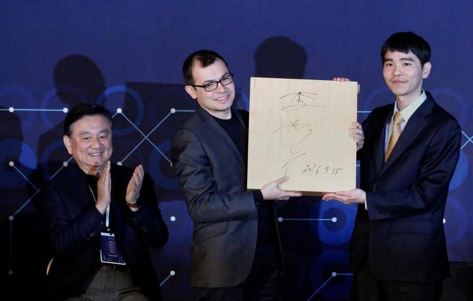 Hassabis celebrates DeepMind’s victory over Go player Lee Sedol, right, in South Korea in 2016<span class="copyright">Lee Jin-man—AP</span>