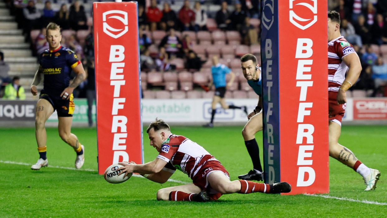 Harry Smith scores a try for Wigan against Catalans