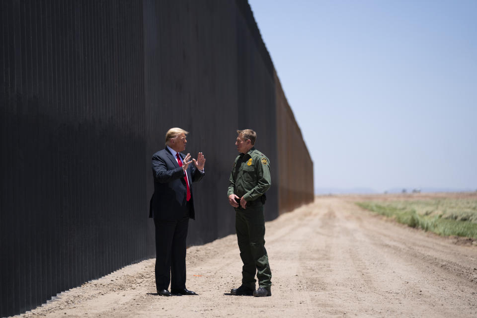 United State Border Patrol chief Rodney Scott gives President Donald Trump a tour of a section of the border wall, Tuesday, June 23, 2020, in San Luis, Ariz. (AP Photo/Evan Vucci)