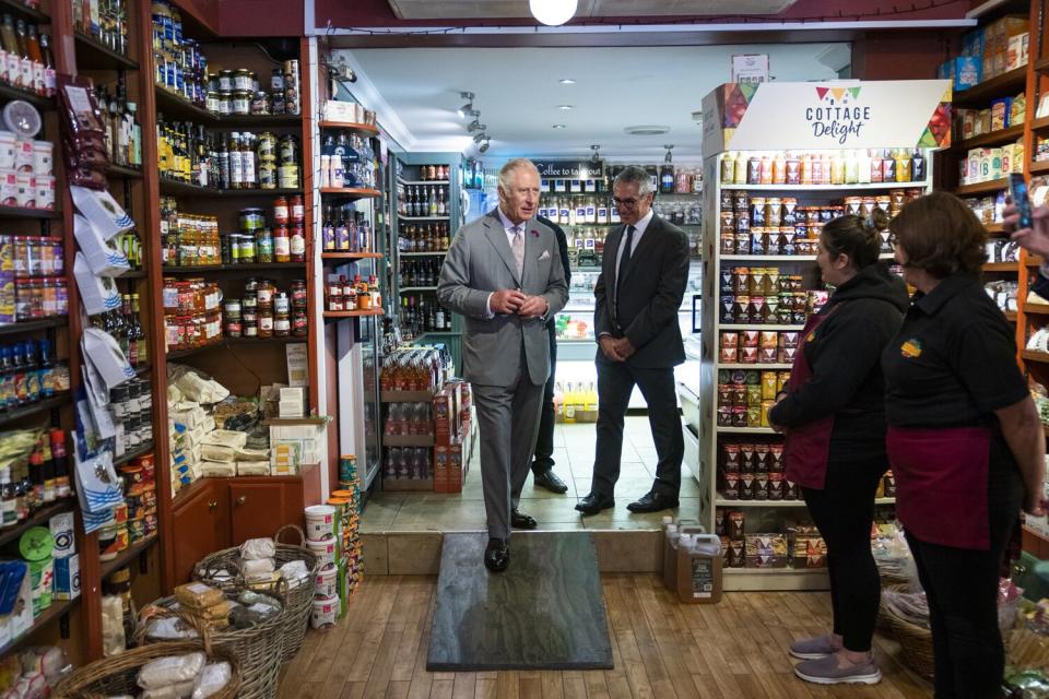 Charles, Prince of Wales visits Wisebuys greengrocers during a visit to the market town of Narberth