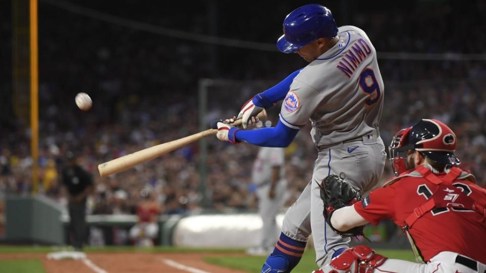 Jul 21, 2023; Boston, Massachusetts, USA; New York Mets center fielder Brandon Nimmo (9) hits a two-run home run during the third inning against the Boston Red Sox at Fenway Park.