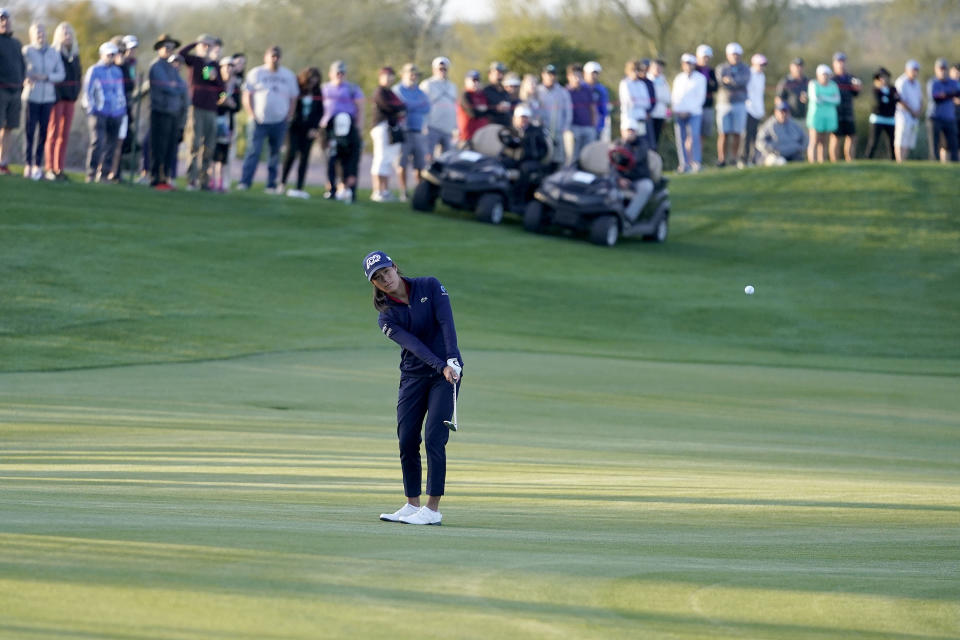 Celine Boutier hits up on the playoff hole during the final round of the Drive On Championship golf tournament, Sunday, March 26, 2023, in Gold Canyon, Ariz. (AP Photo/Darryl Webb)