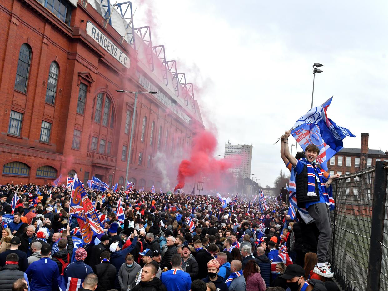 Rangers fans gather to celebrate at the club’s Ibrox Stadium (Getty Images)