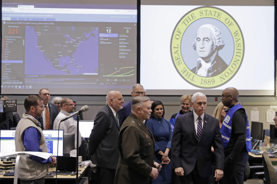 Vice President Mike Pence, second from right, tours the Washington State Emergency Operations Center, Thursday, March 5, 2020 at Camp Murray in Washington state. (AP Photo/Ted S. Warren)