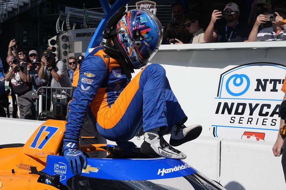 Kyle Larson climbs out of his car during qualifications for the Indianapolis 500 auto race at Indianapolis Motor Speedway, Sunday, May 19, 2024, in Indianapolis. (AP Photo/Darron Cummings)