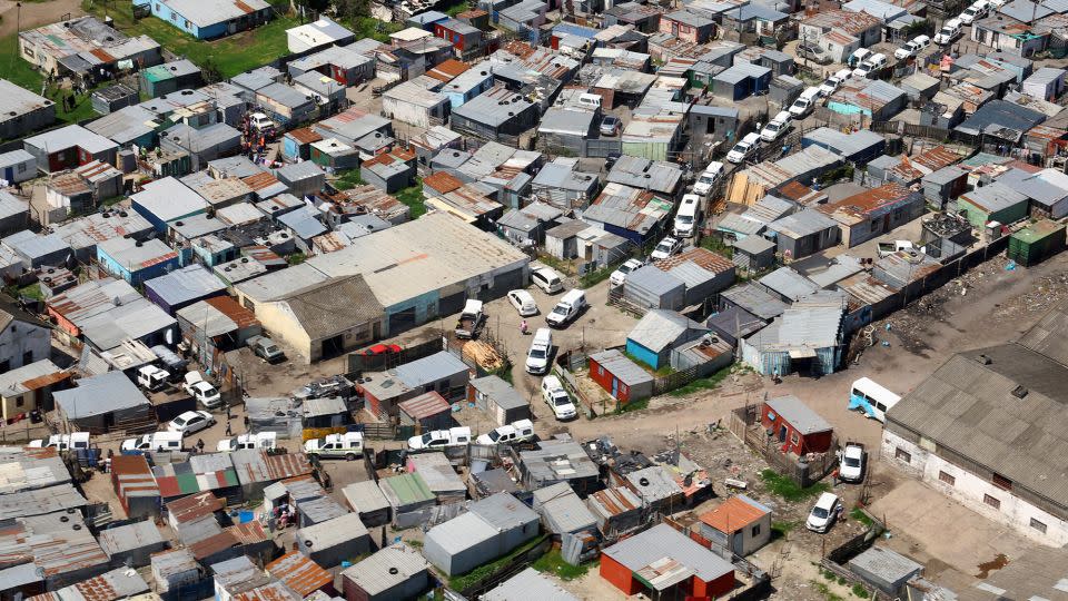 Police and law enforcement vehicles are seen in what the Cape Town mayor's office described as the "biggest anti-crime operation" in its history, in Cape Town, South Africa, on October 12, 2022. - Esa Alexander/Reuters