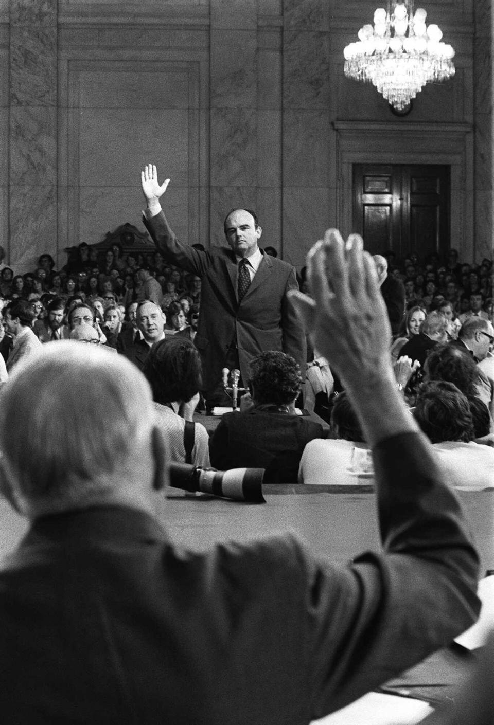 <p>John D. Ehrlichman, Nixon’s domestic affairs adviser, is sworn-in by Sen. Sam Ervin, Jr., prior to testifying before the Senate Watergate Committee on July 24, 1973. Ehrlichman was imprisoned for 18 months for his part in the Watergate conspiracy. (Photo: AP) </p>